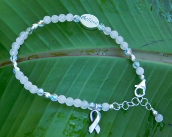 Believe In Your Strength is Created with Rose Quartz, Crystals, SS Believe Word Bead, Awareness Ribbon Charm with SS Chain and Lobster Clasp