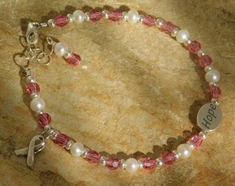 Hope bracelet is Created with Fresh Water Pearls, Crystals, Sterling Silver Hope Word Bead, Spacer Beads, Lobster Clasp, Chain and Dangle