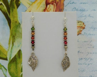Budding Leaves Series III is Created with a Variety of Colored Crystals with Bali Daisy Beads Above SS Leaf Charm Hanging on SS Posts