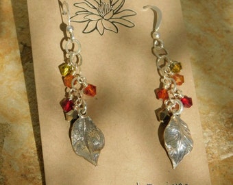 Budding Leaves II is Created with Colored Crystals Wire Wrapped on Silver Chain, Above SS Leaf Charms Hanging from SS French Ear Wires