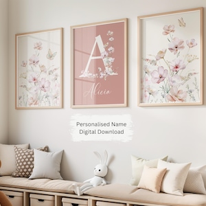 May include: Three printable wall art prints featuring a floral design with butterflies and the letter A with the name Alicia. The prints are in a light pink, white, and green colour scheme.
