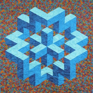 May include: A blue and turquoise quilt with a geometric pattern of overlapping squares. The quilt is made of fabric with a swirling pattern in shades of red, orange, yellow, green, and blue.