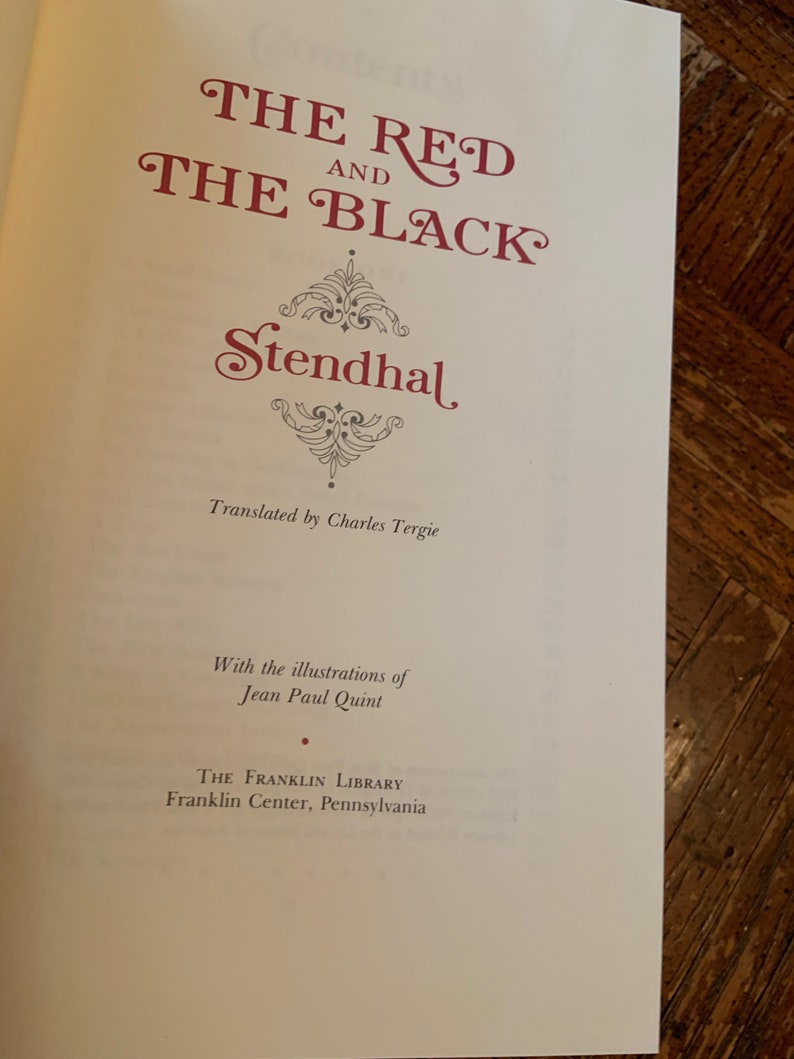 May include: The Red and the Black by Stendhal, translated by Charles Tergie. The book cover features a decorative title in red lettering with a grey and white floral design.