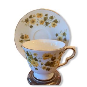 Queen Anne Tea Cup & Saucer -Yellow Flowers w/ Greenery