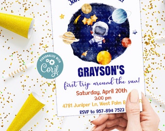 May include: A printable invitation for a child's birthday party with a space theme. The invitation features a cartoon astronaut holding stars, planets, and a blue and white starry sky background. The text on the invitation reads "Join us as we celebrate! Grayson's first trip around the sun! Saturday, April 20th 3:00 pm 4781 Juniper Ln, West Palm B RSVP to 957-894 7523".