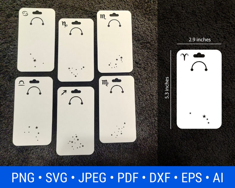 May include: Set of 7 white blank earring display cards with black zodiac symbols and constellation outlines. Each card measures 13.5 cm by 7.4 cm.