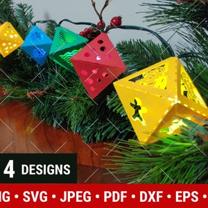 May include: Four paper Christmas light designs with a red, yellow, green, and blue color scheme. The lights are strung on a wire and are lit up. The text "4 DESIGNS" is visible in the image.
