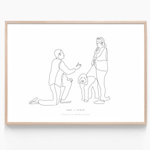 May include: A framed line art print featuring a marriage proposal scene. A man kneels before a woman holding a dog on a leash. The print is in black lines on a white background, with the names "NAN + STEVE" at the bottom.
