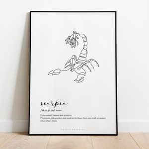 May include: Black framed art print featuring a minimalist line drawing of a scorpion. The word "scorpio" is written below the image, along with its pronunciation and a brief description of the zodiac sign's characteristics. The artwork is displayed on a white background.