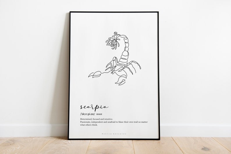 May include: Black framed art print featuring a minimalist line drawing of a scorpion. The word "scorpio" is written below the image, along with its pronunciation and a brief description of the zodiac sign's characteristics. The artwork is displayed on a white background.