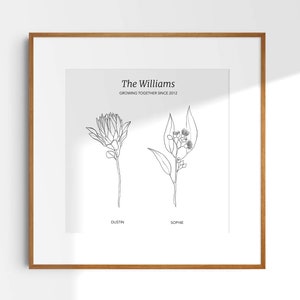 May include: A black and white line art print of two flowers with the text "The Williams Growing Together Since 2012" at the top. The flowers are labeled "Dustin" and "Sophie".