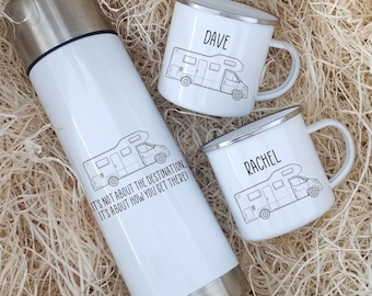 May include: A white insulated travel mug with a black camper van graphic and the text "It's not about the destination, it's about how you get there!" Two white enamel mugs with black camper van graphics and the names "Dave" and "Rachel" printed on them.