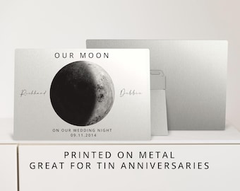 May include: A silver metal sign with a black and white image of the moon on our wedding night, with the date 09.11.2014 and the names Richard and Debbie. The sign reads "Our Moon" and "Printed on Metal, Great for Tin Anniversaries".
