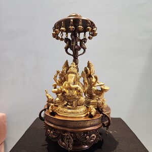 Brass Laxmi Ganesh Saraswati Revolving Statue: Hindu God Idol