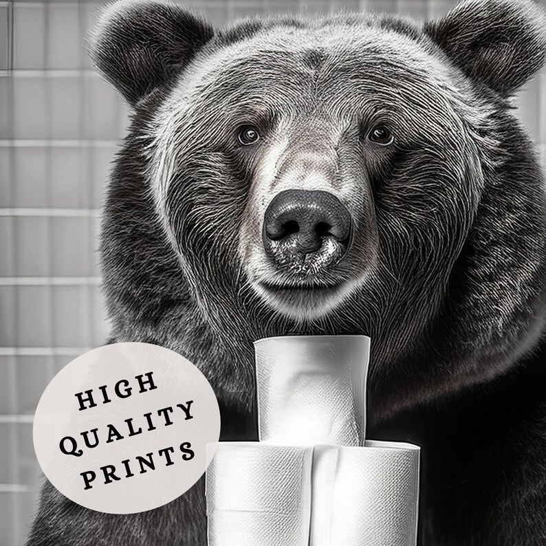 May include: A black and white photo of a bear looking directly at the camera. The bear is holding a stack of toilet paper rolls in front of it. The text "HIGH QUALITY PRINTS" is on a white circle in the lower left corner of the image.