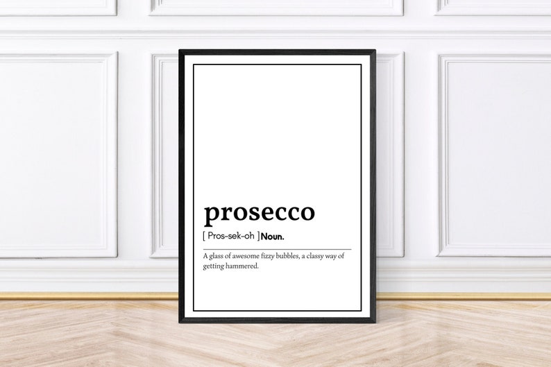May include: Black framed print with the word "prosecco" in a bold font. Below, the definition reads: "A glass of awesome fizzy bubbles, a classy way of getting hammered."