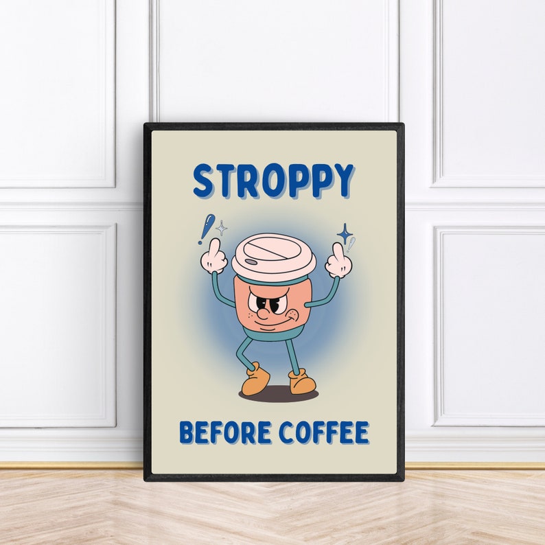 Może przedstawiać: Beżowy plakat w czarnej ramie przedstawiający kresk&oacute;wkową filiżankę kawy z kwaśną miną i tekstem "STROPPY BEFORE COFFEE".