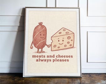May include: A framed print featuring a cartoon illustration of a smiling sausage and a smiling cheese wedge holding hands. The text "meats and cheeses always pleases" is below the characters. The artwork is in shades of brown and beige.