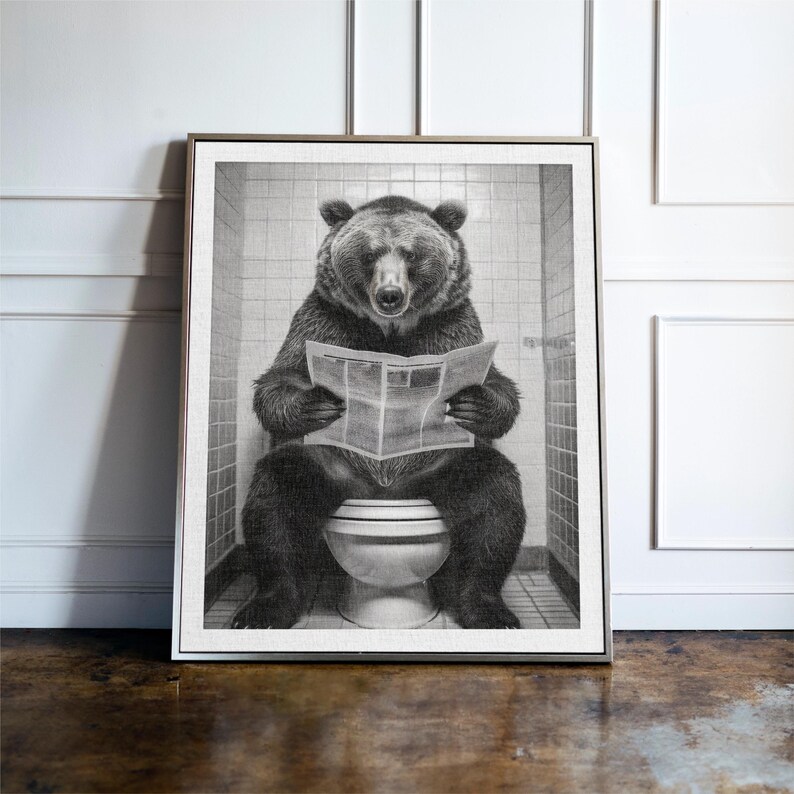 May include: A black and white photograph of a bear sitting on a toilet and reading a newspaper.