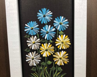 White, teal, and yellow daisies painted on screen.