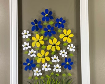 Blue, white, and yellow flowers painted on glass.