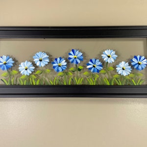 Blue flowers painted on glass. image 2