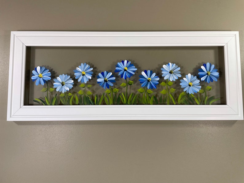 Blue flowers painted on glass. image 1