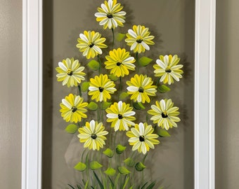 Yellow daisies painted on glass.