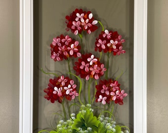 Geraniums painted on glass.