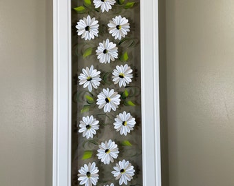 White flowers painted on glass.