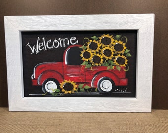 Red truck with sunflowers painted on screen.