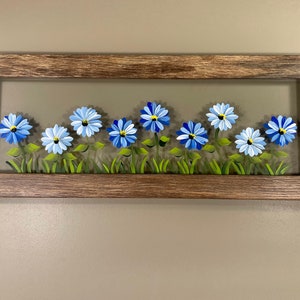 Blue flowers painted on glass. image 3