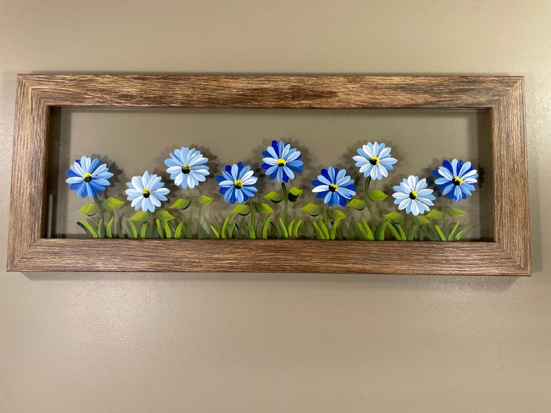 Blue flowers painted on glass. image 3