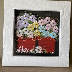 White, light teal, light pink, light purple and yellow daisies in flower pots painted on screen.