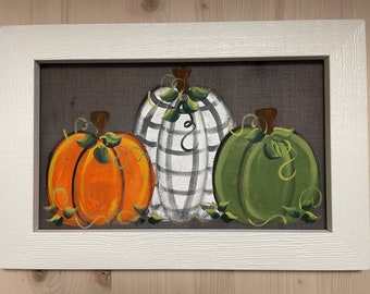 Pumpkins painted on screen.