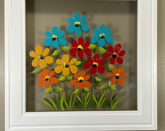 Multi colored flowers painted on glass.