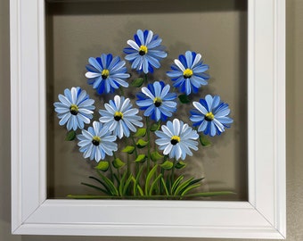 Blue flowers painted on glass.