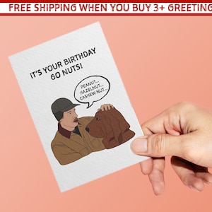 May include: A white greeting card with a cartoon illustration of a man with a dog. The text on the card reads "It's your birthday go nuts! Peanut... Hazelnut... Cashew nut..."