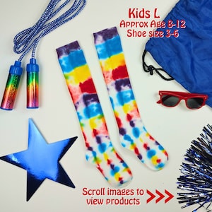 May include: Two pairs of colorful tie-dye knee-high socks. The socks are white with blue, red, yellow, and purple tie-dye patterns. The socks are on a white background. Kids L Approx Age 8-12 Shoe size 3-6. Scroll images to view products.