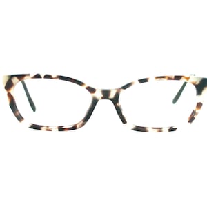 May include: A pair of eyeglasses with a tortoiseshell pattern on the frames. The frames have a cat-eye shape and are a mix of brown, black, and white. The lenses are clear, and the arms are black.