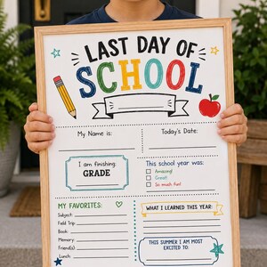 May include: A rectangular white sign in a light wood frame featuring the text LAST DAY OF SCHOOL. The sign includes sections for name, date, grade, school year reflections, favourites, and what was learned, decorated with a pencil and apple.