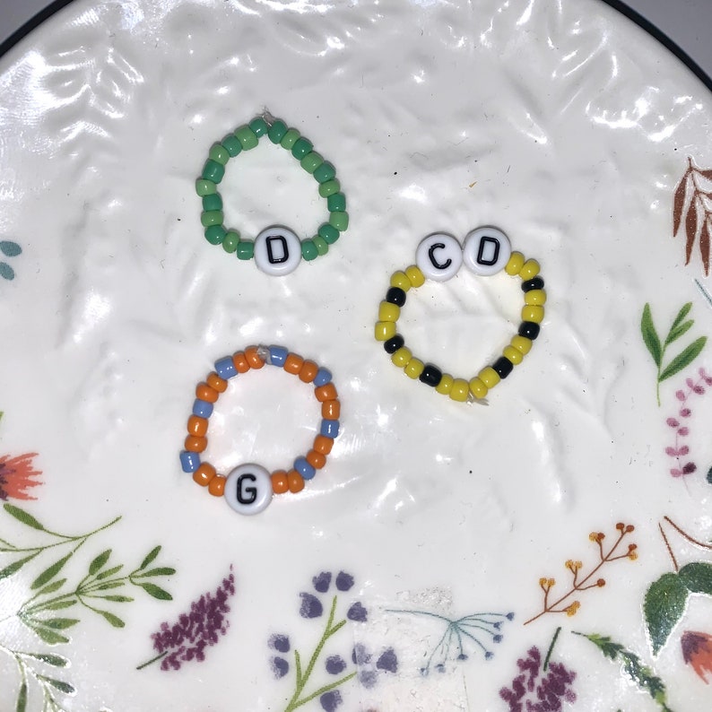 Beaded Initial Elastic Rings