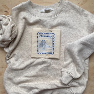 Parche bordado con sello vintage: aplique termoadhesivo de viaje retro