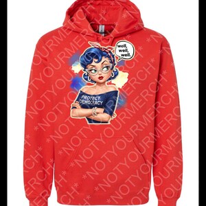May include: Red hooded sweatshirt with a graphic of a woman with blue hair, glasses, and a red headband. The graphic includes the text "PROTECT DEMOCRACY" and a speech bubble saying "well, well, well."