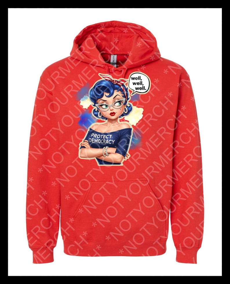 May include: Red hooded sweatshirt with a graphic of a woman with blue hair, glasses, and a red headband. The graphic includes the text "PROTECT DEMOCRACY" and a speech bubble saying "well, well, well."