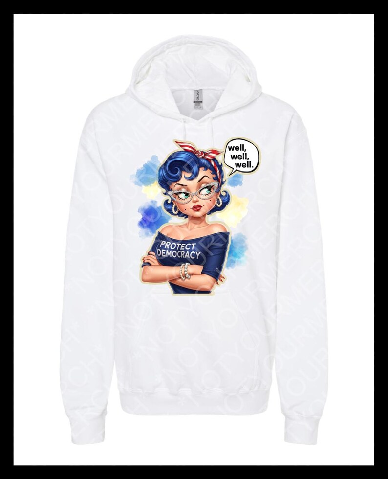May include: White hoodie with a graphic of a woman with blue hair, glasses, and a red headband. The graphic includes the text "PROTECT DEMOCRACY" and speech bubbles saying "well, well, well."
