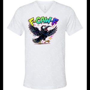 May include: White V-neck t-shirt featuring a cartoon crow with outstretched wings and an open beak. The crow is black with yellow feet and is surrounded by colorful paint splatters. The text "F-CAW-F" is above the crow.