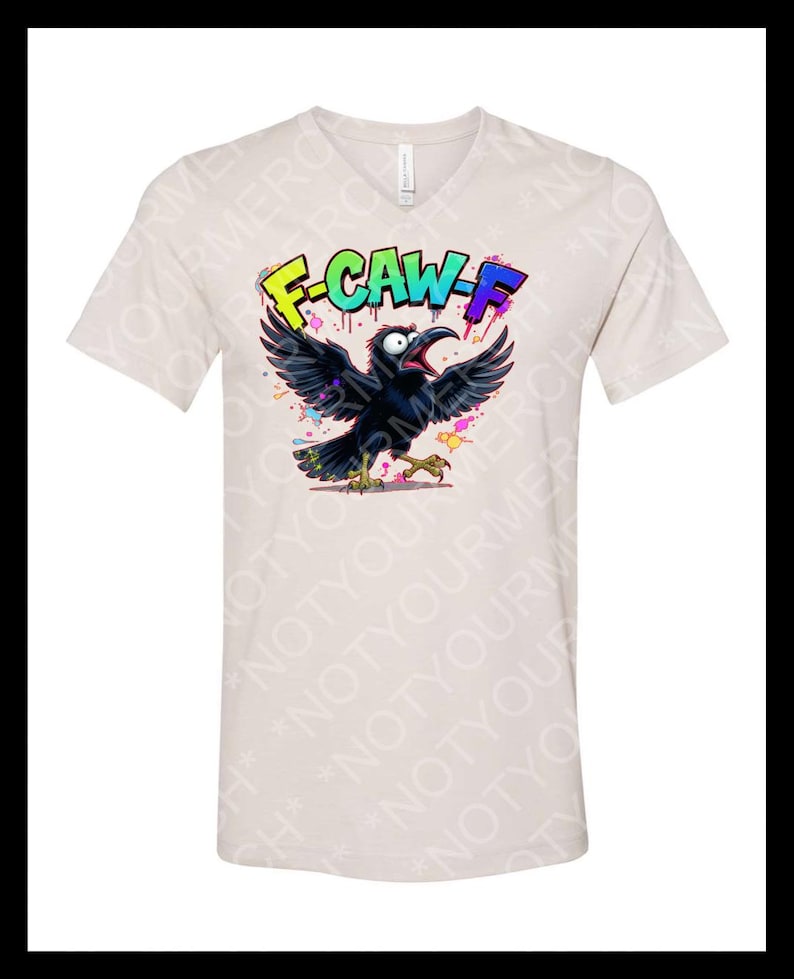 May include: Beige V-neck t-shirt featuring a cartoon crow with open wings and a wide open beak. The crow is black with colorful accents. The text "F-CAW-F" is above the crow in bright colors.