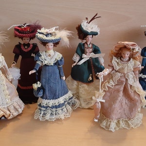 Dolls house miniature 'Bring on the girls' Victorian Porcelain Ladies/Dolls dressed in Beautiful outfits including Stand. All very Poseable