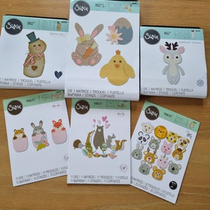 Une collection de matrices de découpe Sizzix, dont BIGZ et Thinlits - Thèmes de Pâques, Noël et animaux pour projets créatifs en papier